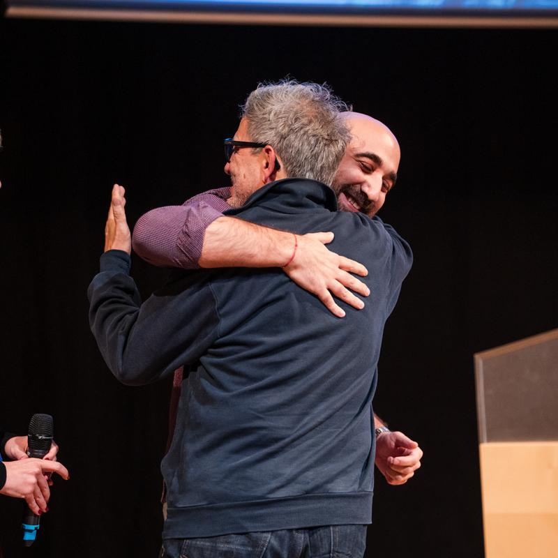 masterschool pitch awards show two men hugging