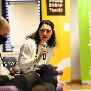 Photo of woman holding microphone