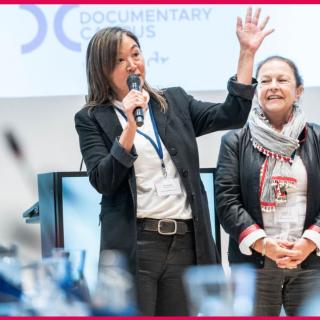 Women speaks in microphone